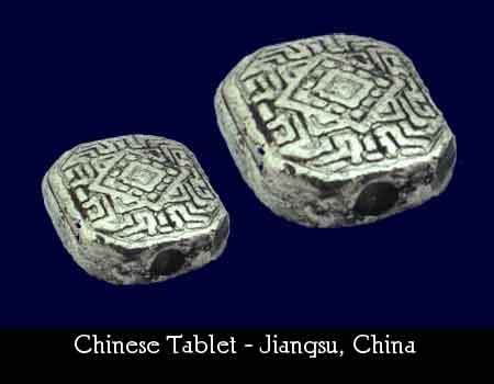 photo of silver tablet bead